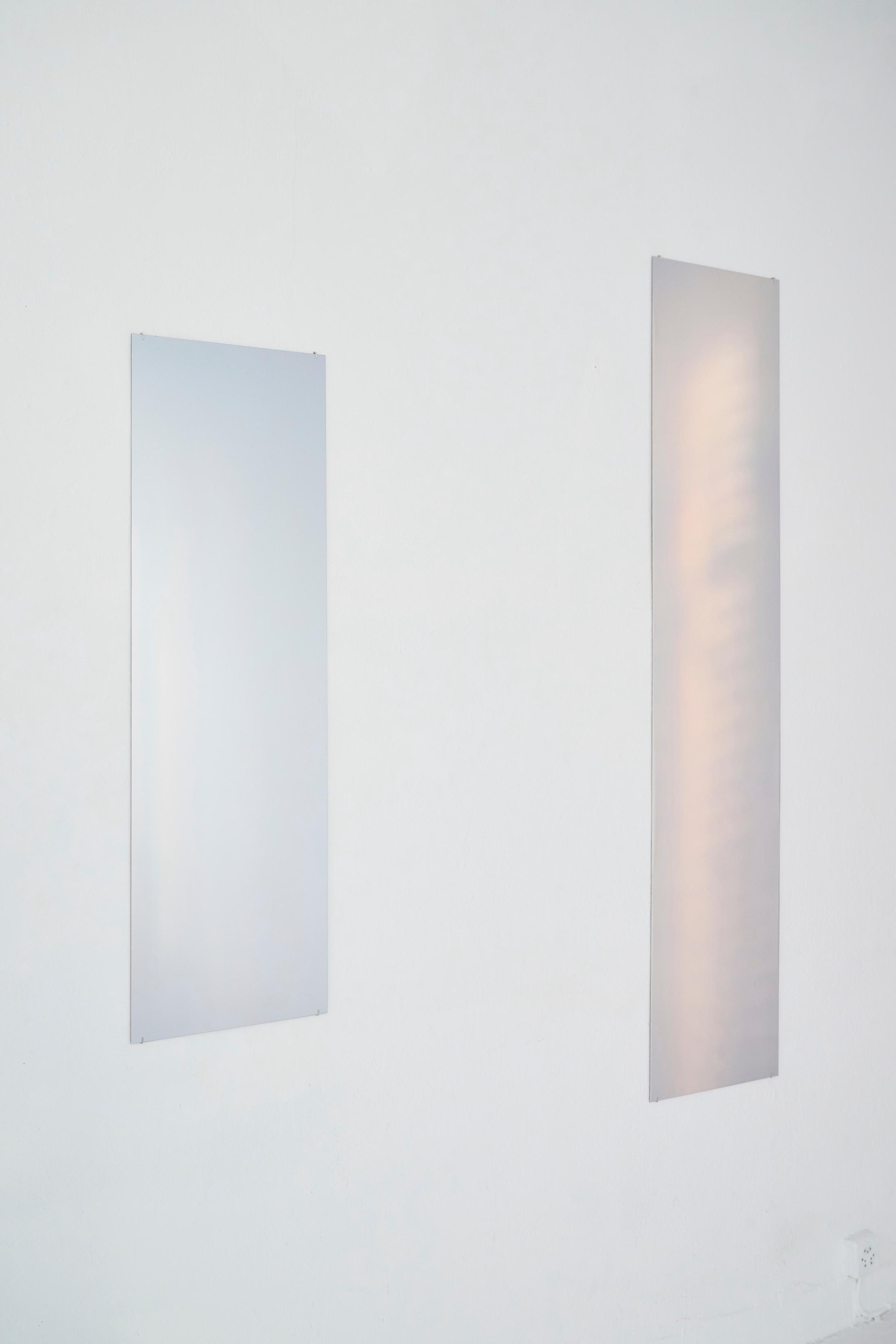 Exhibition View Solo Show Pauline Cordier «Holding Time; view on Pauline Cordier, 11.2023, reflective material, 121 × 39 cm, 2024 & 12.2023, reflective material,180 × 39 cm, 2024» at andata ritorno - laboratoire d'art contemporain, Geneva, 2024 / Photo: Loïc Herin / Courtesy: The artist and andata ritorno - laboratoire d'art contemporain