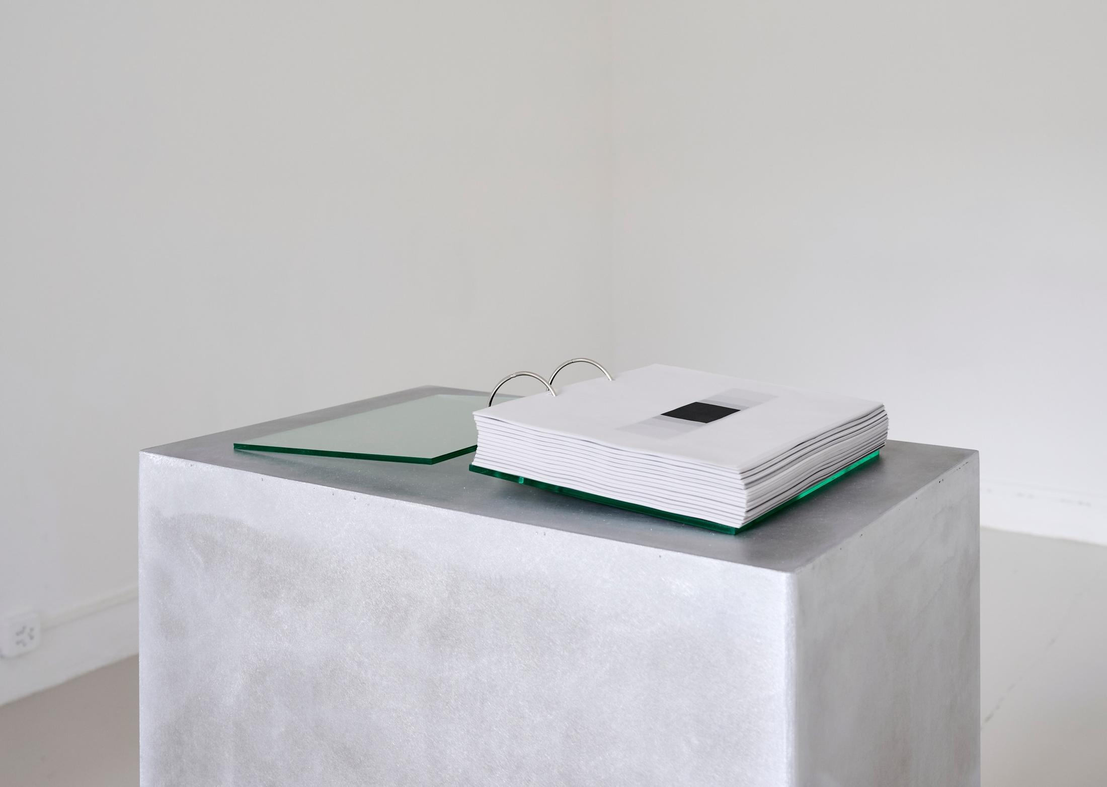 Exhibition View Solo Show Pauline Cordier «Holding Time; view on Pauline Cordier, 366, glass, printed on tracing paper, brushed aluminium, edition : 25 × 20 × 4 cm, base : 100 × 55 × 35 cm, 2024» at andata ritorno - laboratoire d'art contemporain, Geneva, 2024 / Photo: Loïc Herin / Courtesy: The artist and andata ritorno - laboratoire d'art contemporain