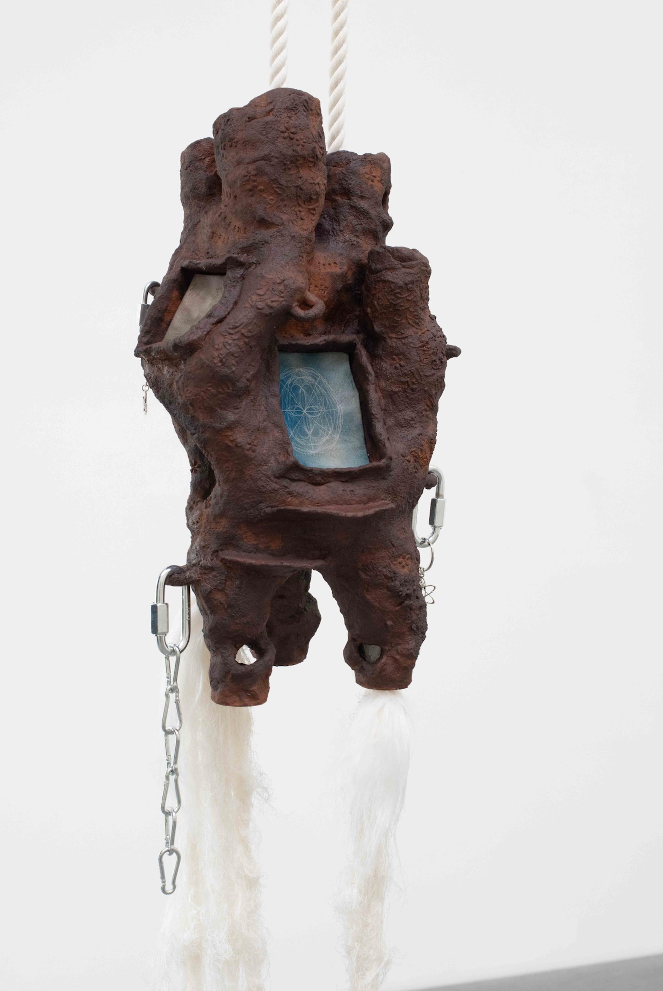 Exhibition View Group Show «QUAE EST IN NATURA ; view on Maya Hottarek, Universal Uterus, 2023, Earthenware, earth, lava, red iron oxide, cyanotipe on canvas, cotton rope, recycled cotton threads, carabiner, pendant, ca. 35 x 35 x 160 cm» at Galerie lange + pult, Zürich, 2024 / Photo: Felix Jungo / Courtesy: the artists and Galerie lange + pult