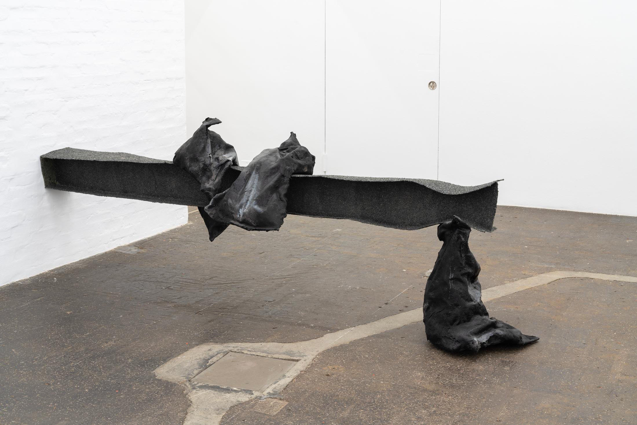 Exhibition View Double Show Sofía Salazar Rosales «Imagínate vivir en Suiza y perderte esto ; view on When the axial skeleton decides to speak & We are contextual and sentimental, 2025, Glass agreggate, charcoal, iron powder, plaster, vinyl glue, fiberglass, polyester resin, epoxy, 100 x 306 x 95 cm» at Kunst Halle Sankt Gallen, St. Gallen, 2025 / Photo: E. Sommer / Courtesy: the artist and ChertLüdde, Berlin