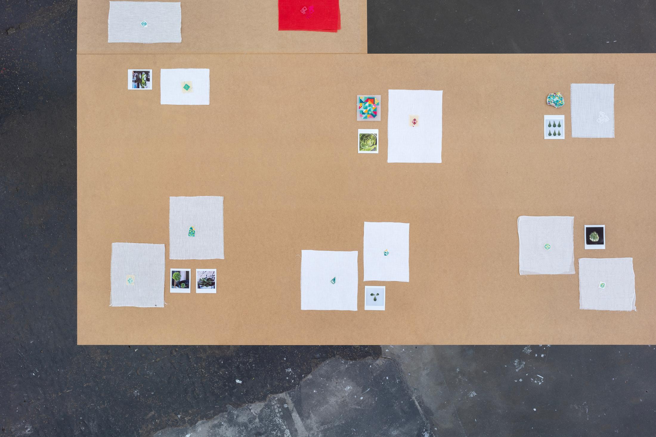 Exhibition View Double Show Majd Abdel Hamid «Resonances ; view on Resonances motifs, 2024/25, Polaroids, cotton thread on linen, cotton, silk, synthetic fabric,  various sizes» at Kunst Halle Sankt Gallen, St. Gallen, 2025 / Photo: E. Sommer / Courtesy: the artist and 16 Avril, Paris