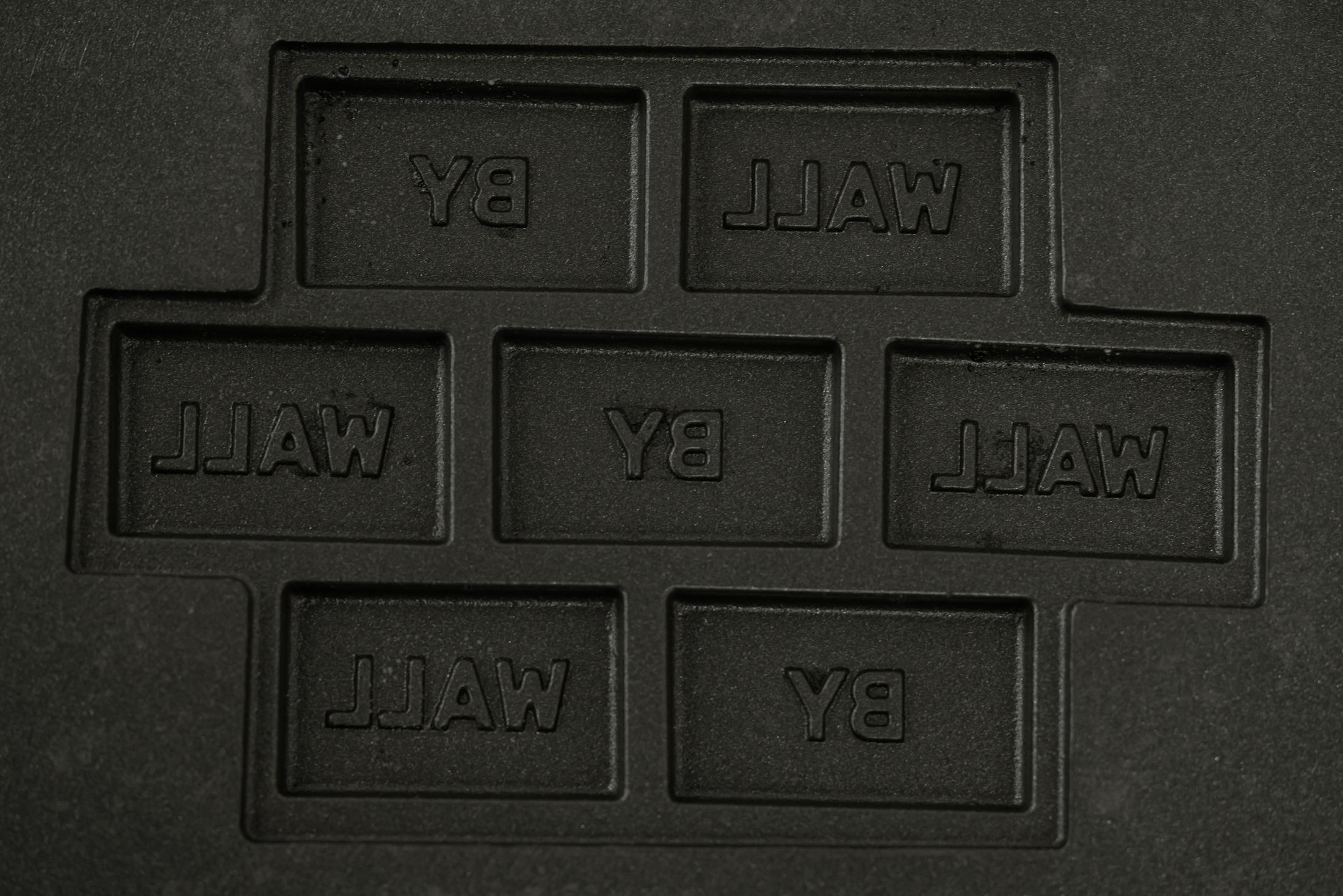 Exhibition View Duo Show Stirnimann-Stojanovic «Connecting through Collective Care and Redistribution; view on Stirnimann-Stojanovic X SoliSoli, SoliSoliWaffle (Detail), Custom-made waffle machine (the waffles mimic a brick wall inscribed with “Brick by Brick” and “Wall by Wall”), 37.5 x 50 x 27 cm, 2024» at WallStreet Fribourg, Fribourg, 2025 / Photo: Julie Folly / Courtesy: the artists and WallStreet