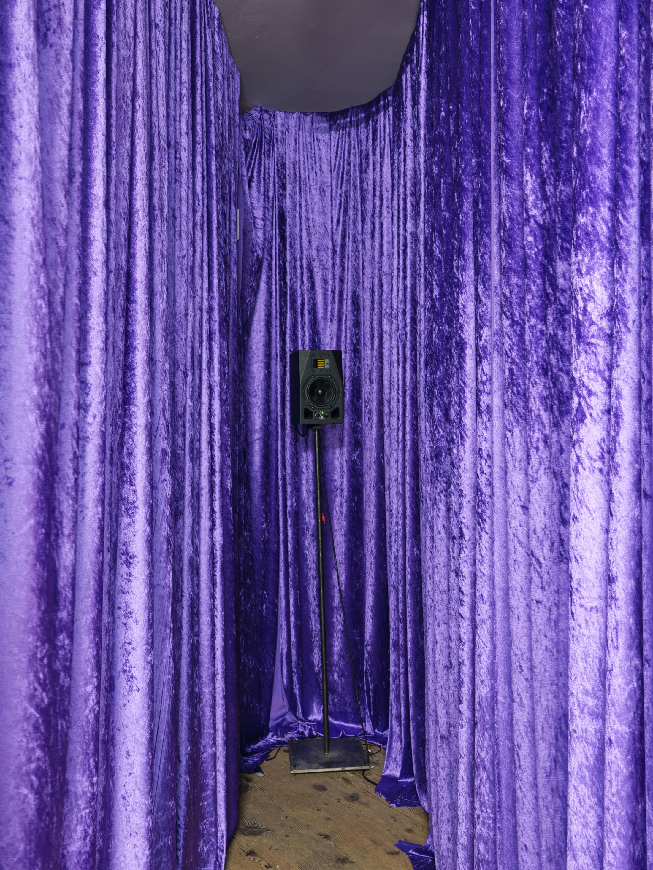 Exhibition View Group Show «The House, the Paste, the Weather (part 1); view on Thuy Tien Nguyen, Transversal seasons (but well, they are all winters) / the 2024 edition with many potential Installation, contains velvet curtain, wood, active speaker, stand, absorbers, metal frame, stainless steel sheets, contact mics, transducer, amplifier, passive speakers, 22’56, 2024» at Stiftung Binz39, Zurich, 2024-2025 / Photo: Conradin Frei / Courtesy: the artists and Stiftung Binz39