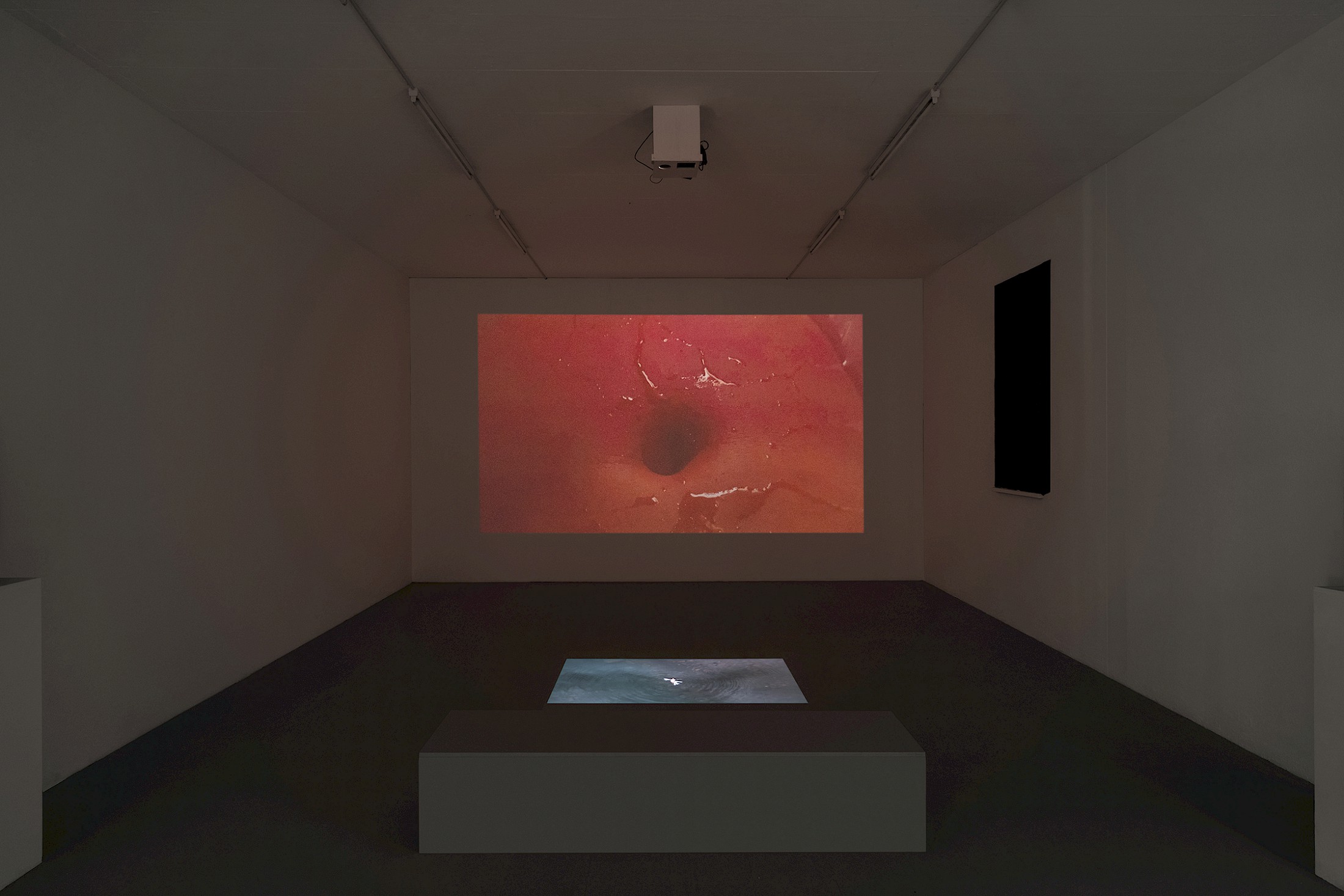 Exhibition View Group Show «Unseen Reconstructions; view on Yumna Al-Arashi, Omphaloskepsis, 2023, site specific video installation, duration 8'27» at La Rada, Locarno, 2023 / Photo: Riccardo Giancola / Courtesy: the artist and La Rada