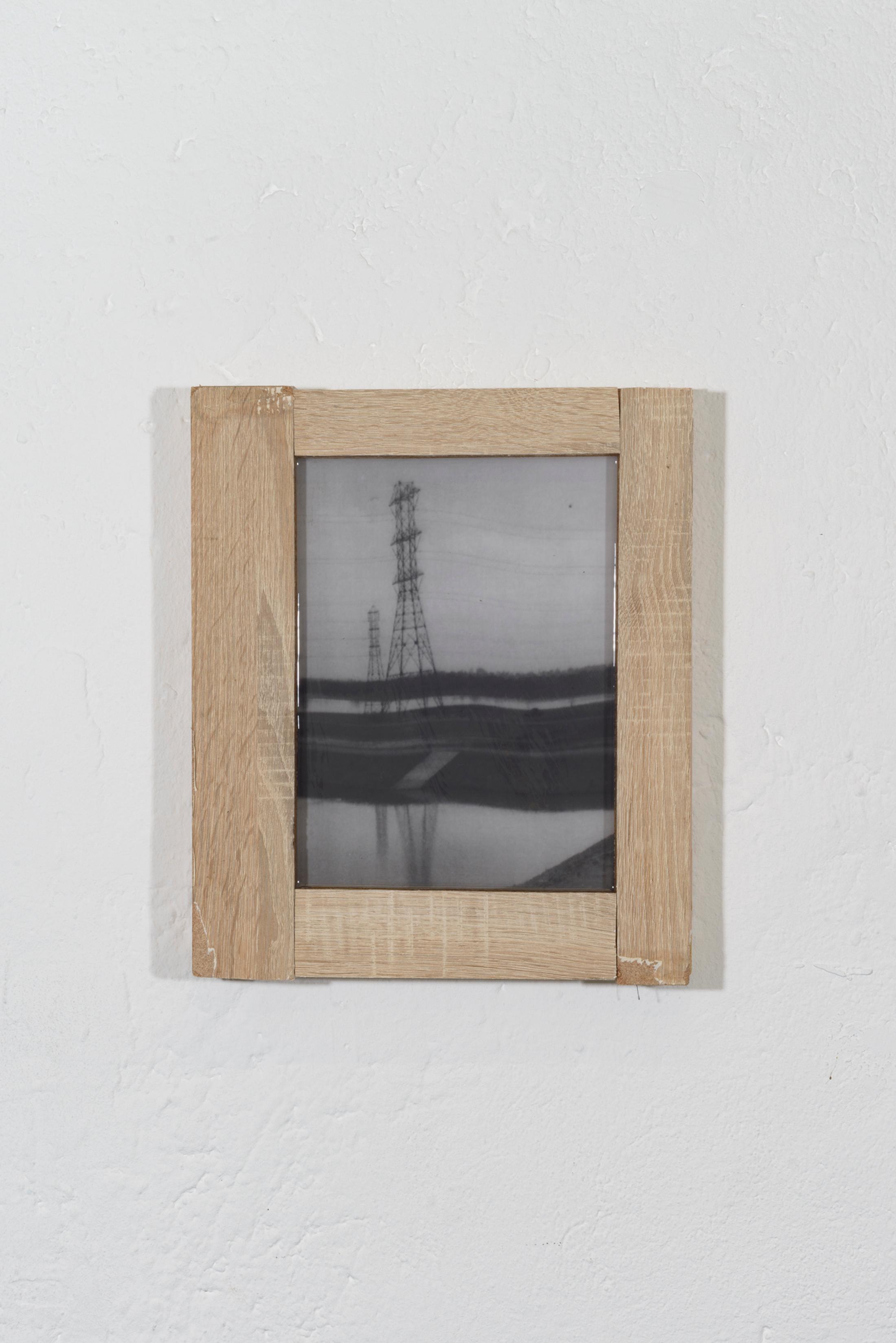 Exhibition View Duo Show Yvan Alvarez and Dylan Hausthor «Upon Onda; view on Yvan Alvarez, IMG_9168, 2024, Black and white silver gelatin print, wood, resin, 39 x 32,5 x 4 cm» at Standard/Deluxe, Lausanne, 2024 / Photo: YAL / Courtesy: the artist and Standard/Deluxe