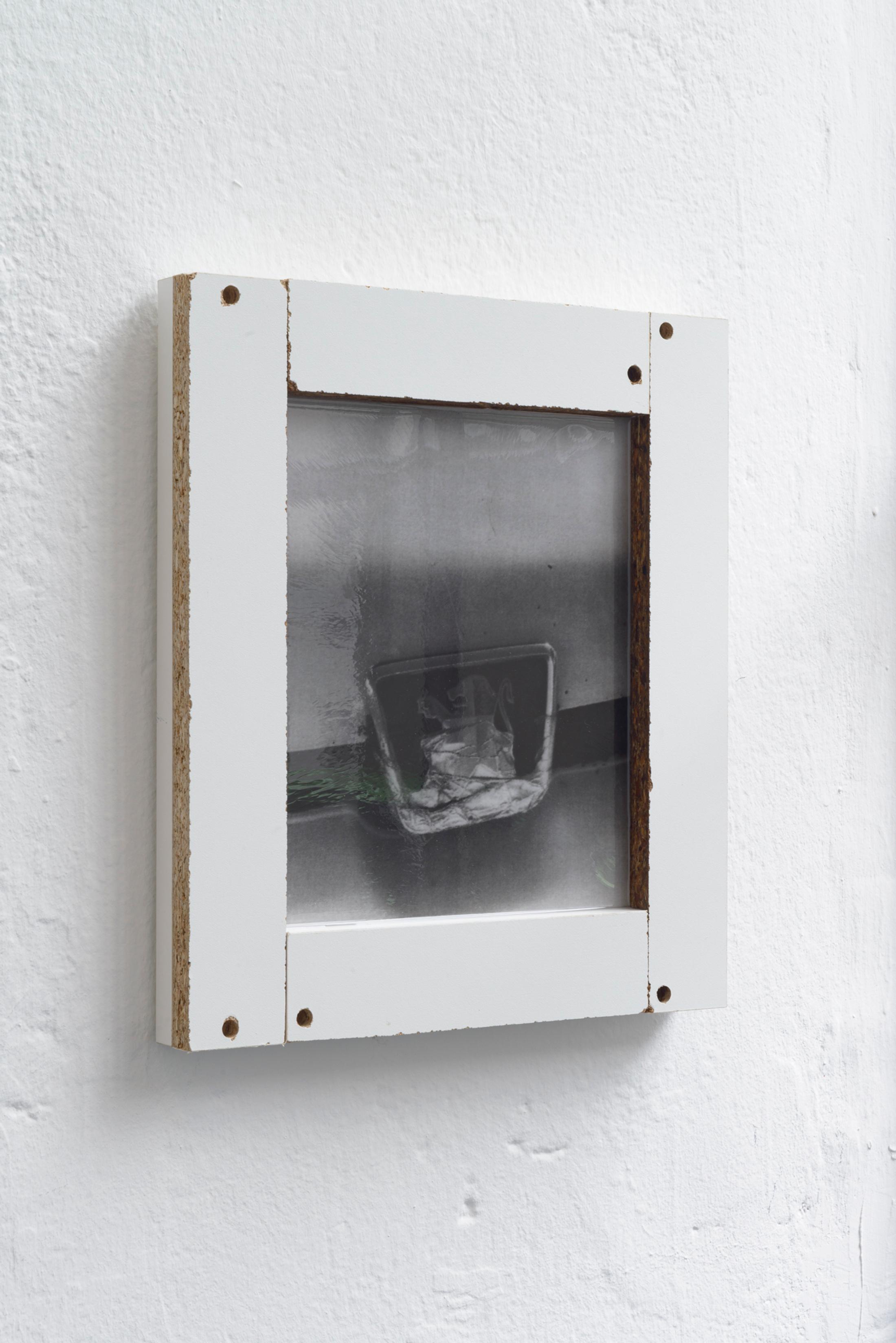 Exhibition View Duo Show Yvan Alvarez and Dylan Hausthor «Upon Onda; view on Yvan Alvarez, IMG_5896, 2024, Black and white silver gelatin print, wood, resin, 33 x 29 x 4 cm» at Standard/Deluxe, Lausanne, 2024 / Photo: YAL / Courtesy: the artist and Standard/Deluxe