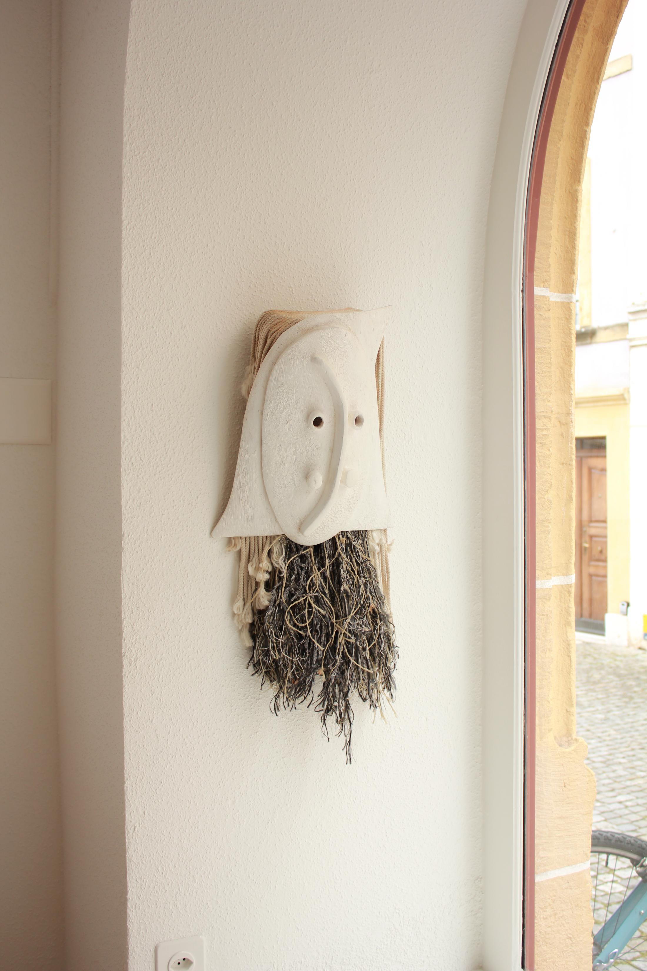 Exhibition View Group Show «BIENNEOPHONE; view on Nora Renaud, Wooden mask, 2021» at Krone Couronne, Biel/Bienne, 2021 / Courtesy: the artist and Krone Couronne