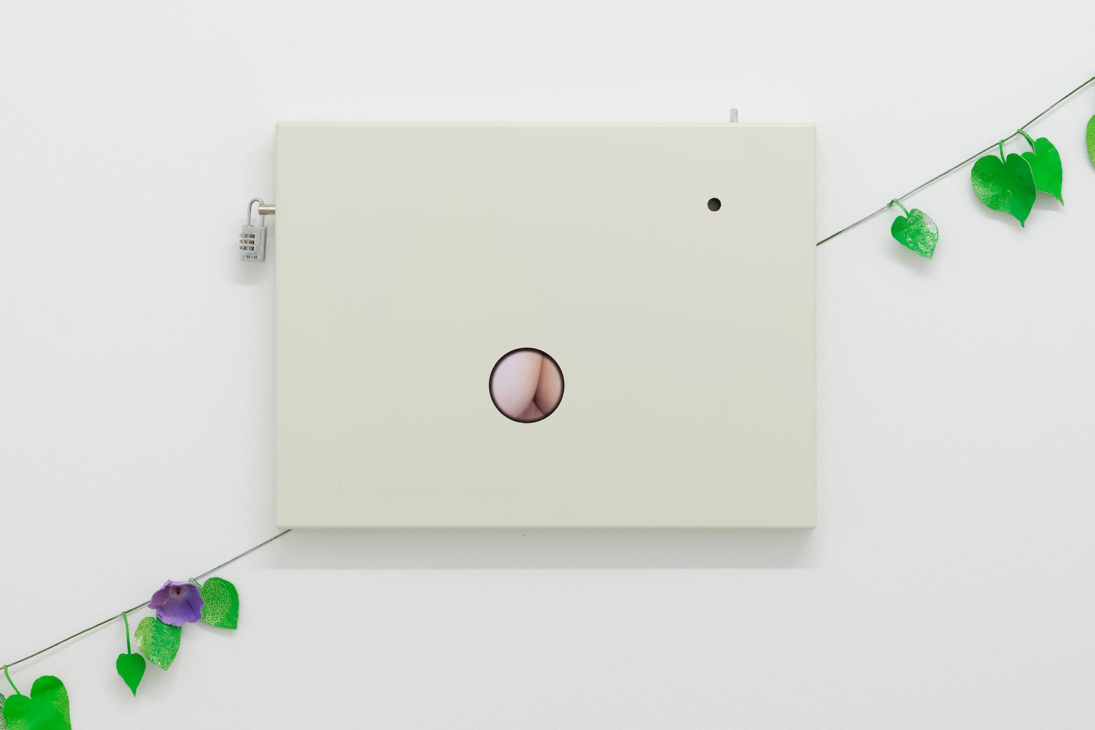 Exhibition View Cassidy Toner Solo Show «Subverting expectations with bad humor and mediocre output; view on Cassidy Toner, ...and compliments to my mother (Étant donnés B-side), 2022, metal, glass, photography, lock, 36 x 46 x 4 cm» at GALERIE PHILIPPZOLLINGER, Zurich, 2022 / Photo: Conradin Frei / Courtesy: the artist and GALERIE PHILIPPZOLLINGER