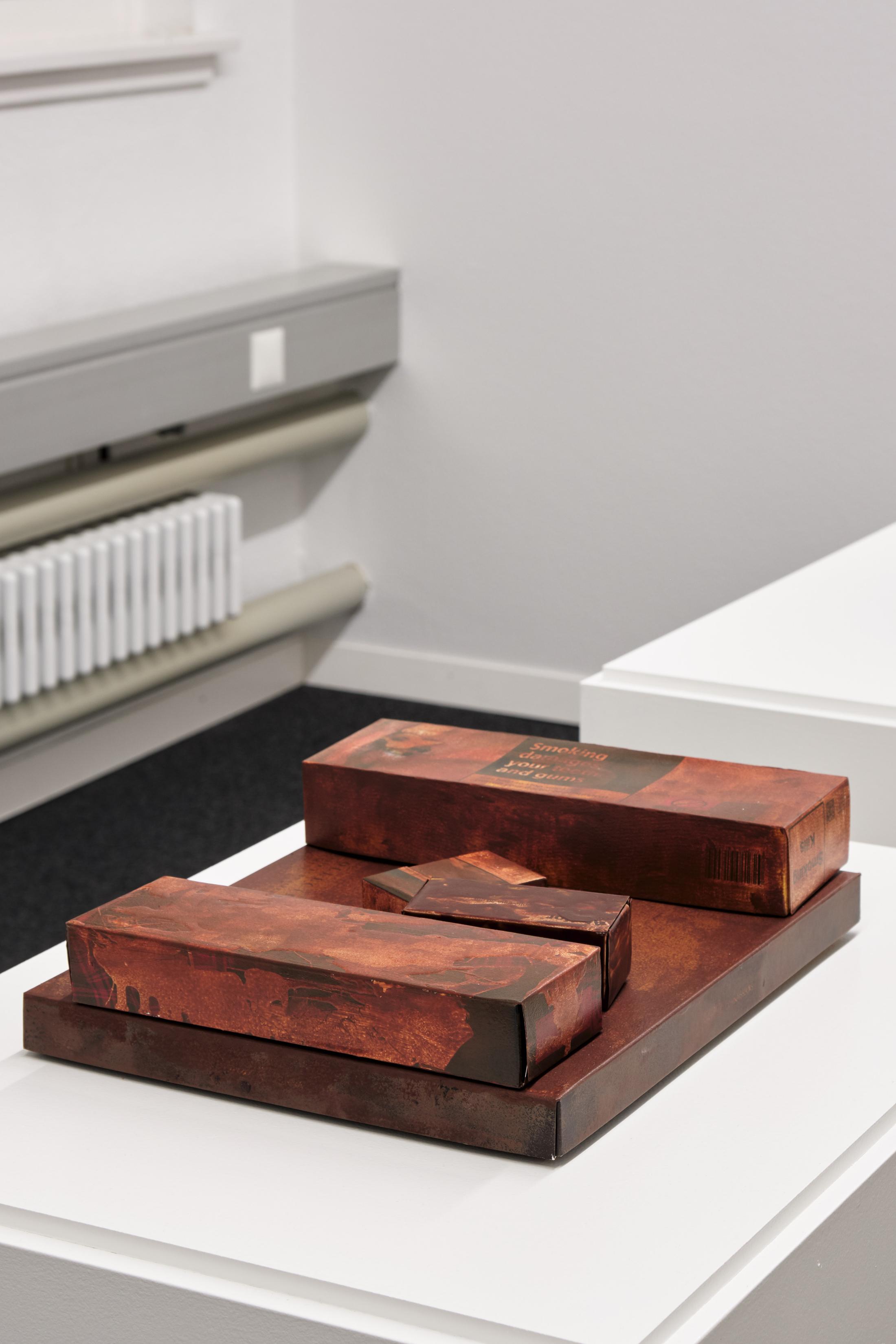 Exhibition View Dominic Michel Solo Show «Trance; view on Dominic Michel, Monuments, 2023, packaging boxes, paint, ca. 65 x 50 x 120 cm» at unanimous consent, Zurich, 2023 / Photo: Philip Ullrich / Courtesy: the artist and unanimous consent