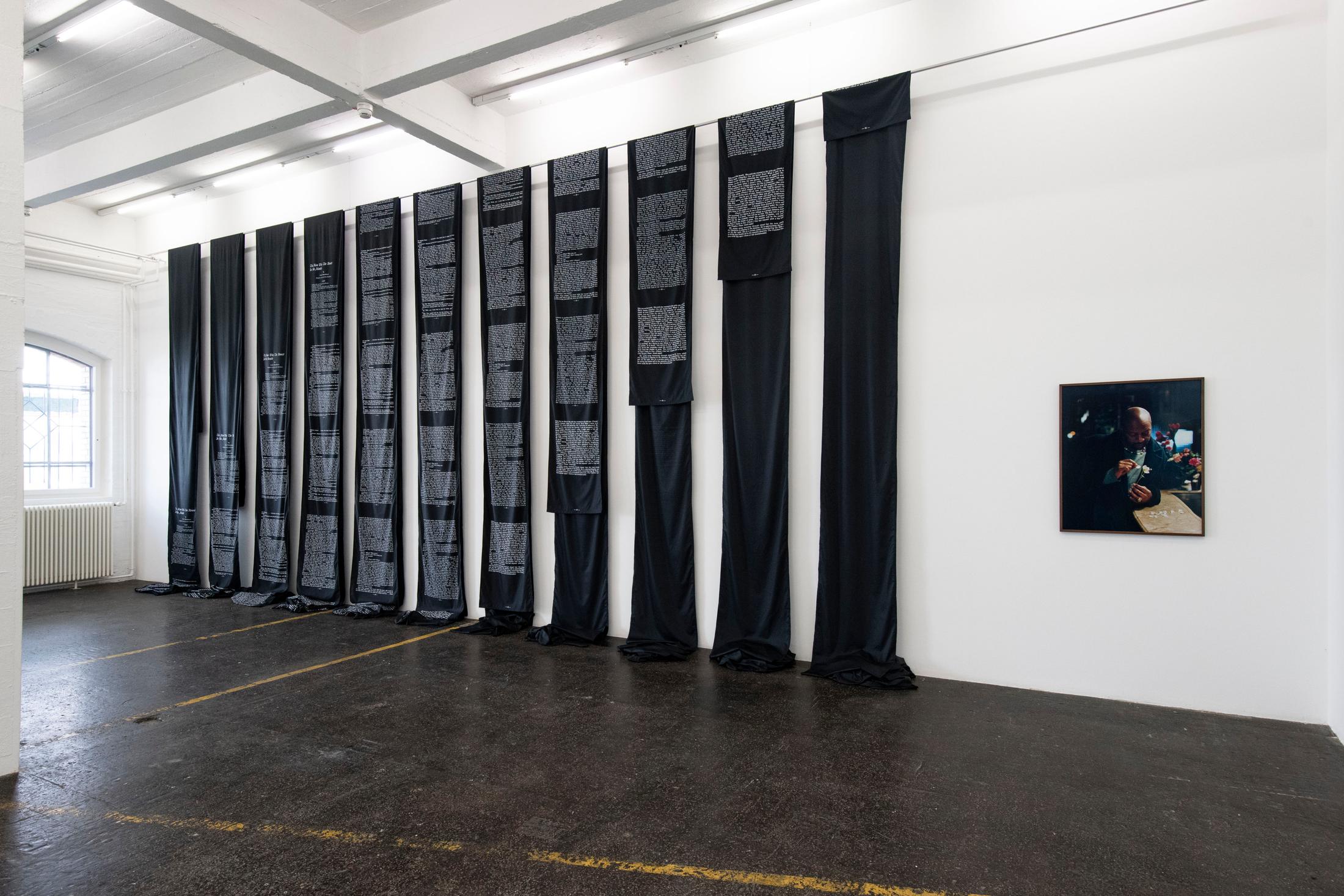 Exhibition View Éric Baudelaire Solo Show «Death Passed My Way and Stuck This Flower in My Mouth; view on Éric Baudelaire, The Man with the Flower in His Mouth, 2021; L’Homme à la fleur, 2021» at Kunst Halle Sankt Gallen, St. Gallen, 2021 / Photo: Kunst Halle Sankt Gallen, Sebastian Schaub / Courtesy: the artist and Kunst Halle Sankt Gallen