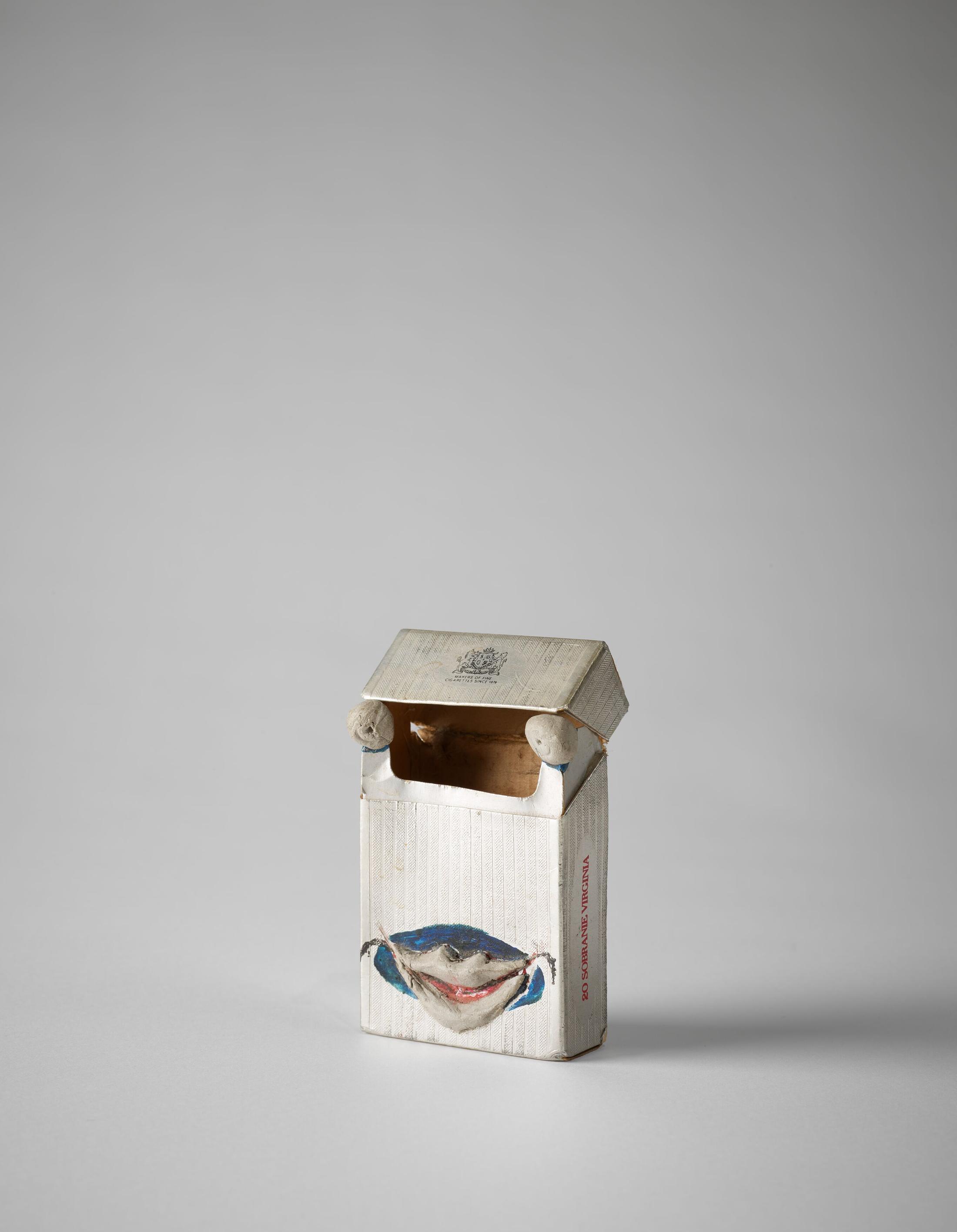 Exhibition View Erna Rosenstein «Solo Show; view on Erna Rosenstein, Untitled, Undated, Cigarette pack, paint, clay elements 
10.5 x 6.4 x 2.5 cm» at Hauser & Wirth, Zurich, 2022-2023 / Photo: Thomas Barratt / Courtesy: The Estate of Erna Rosenstein / Adam Sandauer, Hauser & Wirth and Foksal Gallery Foundation