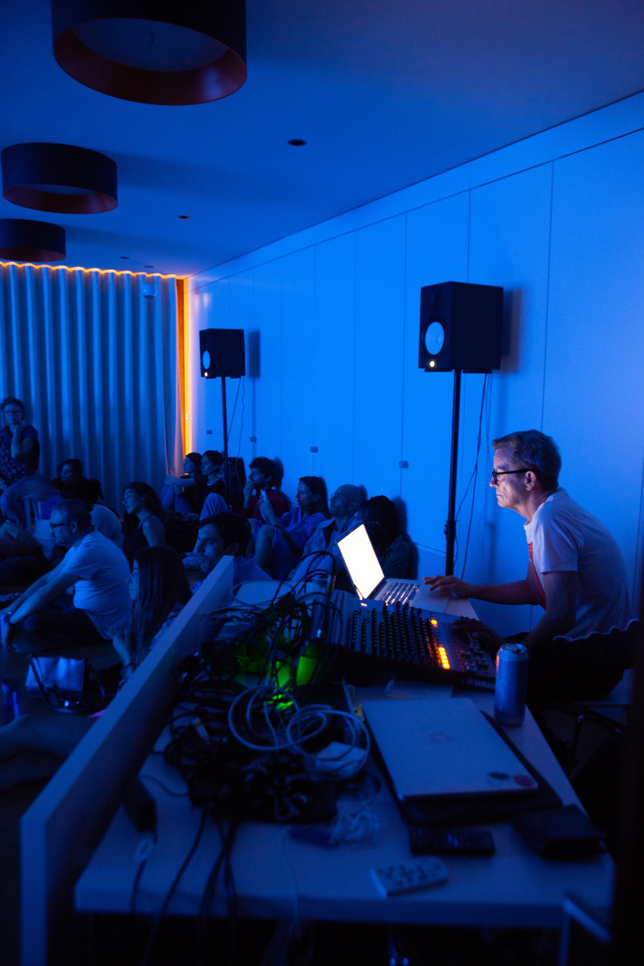 Exhibition View Groupshow «Modern Nature – an hommage to Derek Jarman; view on Simon Fisher Turner performing live score on Derek Jarman’s Blue and a selection of super-8 movies, 2019» at La Becque, La Tour-de-Peilz, 2019 / Photo: © Diana Martin / Courtesy: the artist and La Becque