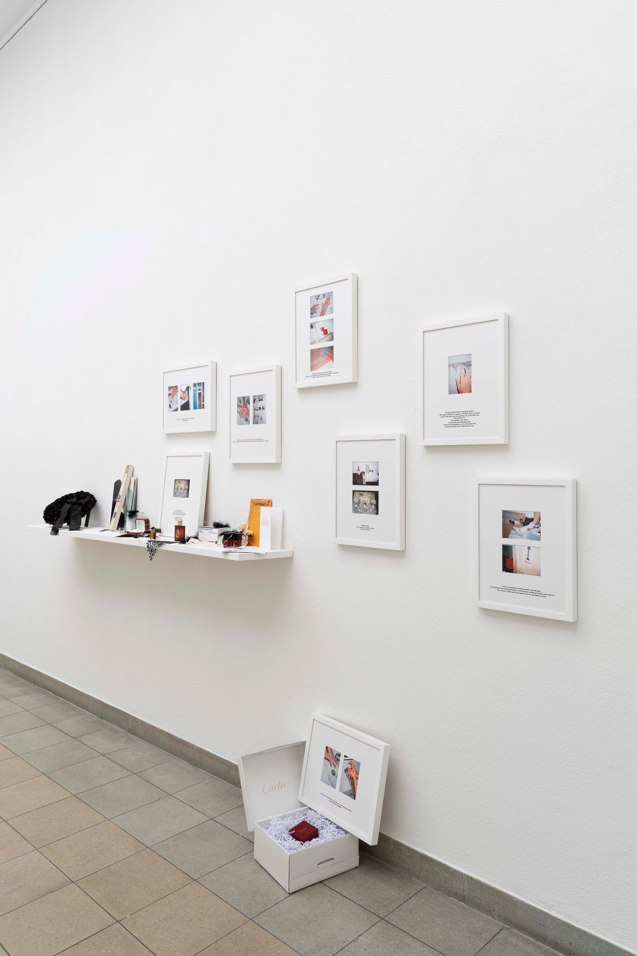 Exhibition View Group Show «Im Volksgarten; view on Olivia Ali ‡Tobias Kaspar, Lost in Messenger, 2020, from coreOATK or Stop Reading my Art as the Story of my Life, 2020, 8 frames with photographs and silkscreen text on matt board, shelf with various objects, 300 x 200 x 30 cm» at Kunsthaus Glarus, Glarus, 2020 / Photo: Gunnar Meier / Courtesy: the artist and Gallery Peter Kilchmann, Zurich