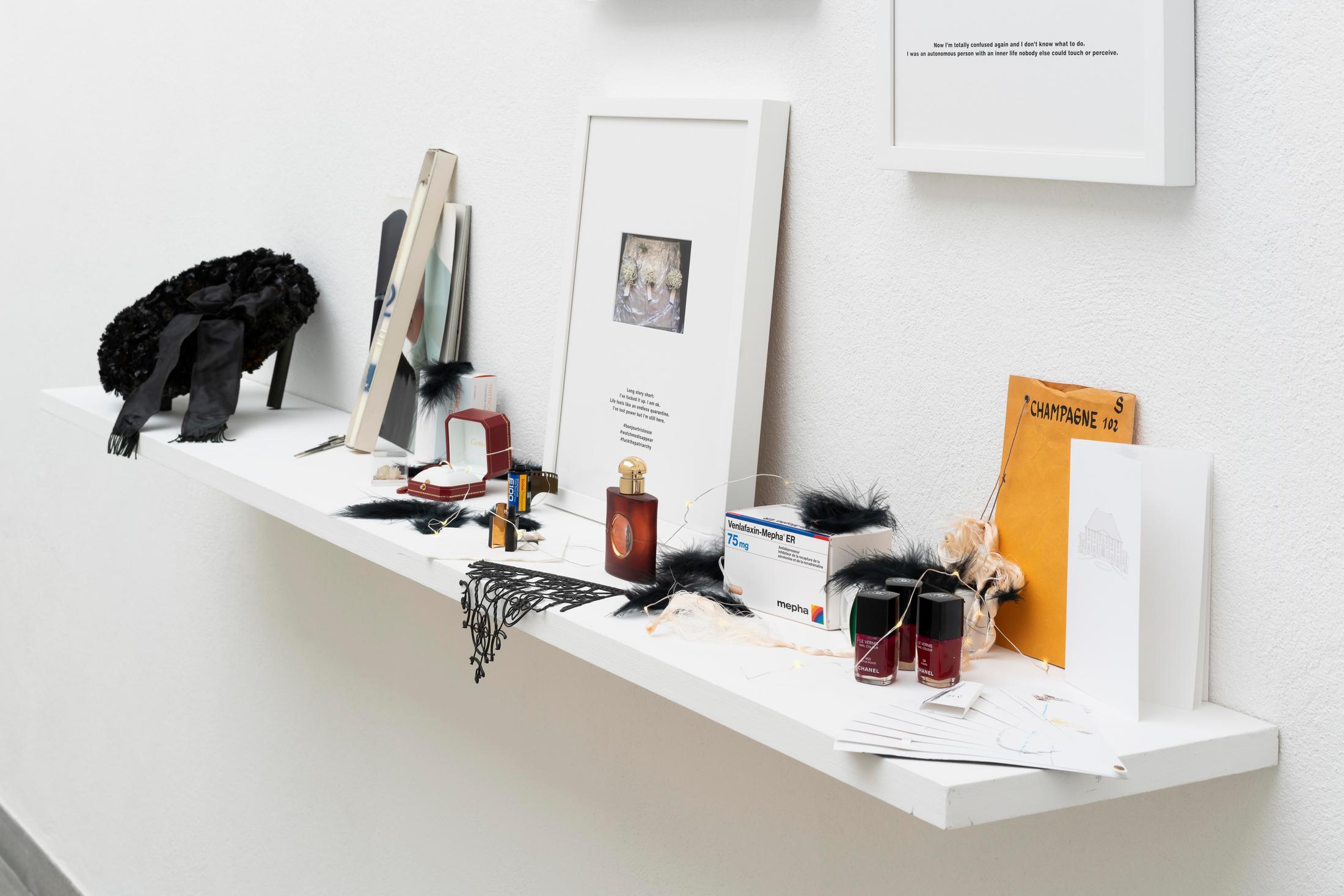 Exhibition View Group Show «Im Volksgarten; view on Olivia Ali ‡Tobias Kaspar, Lost in Messenger, 2020, from coreOATK or Stop Reading my Art as the Story of my Life, 2020, 8 frames with photographs and silkscreen text on matt board, shelf with various objects, 300 x 200 x 30 cm» at Kunsthaus Glarus, Glarus, 2020 / Photo: Gunnar Meier / Courtesy: the artist and Gallery Peter Kilchmann, Zurich