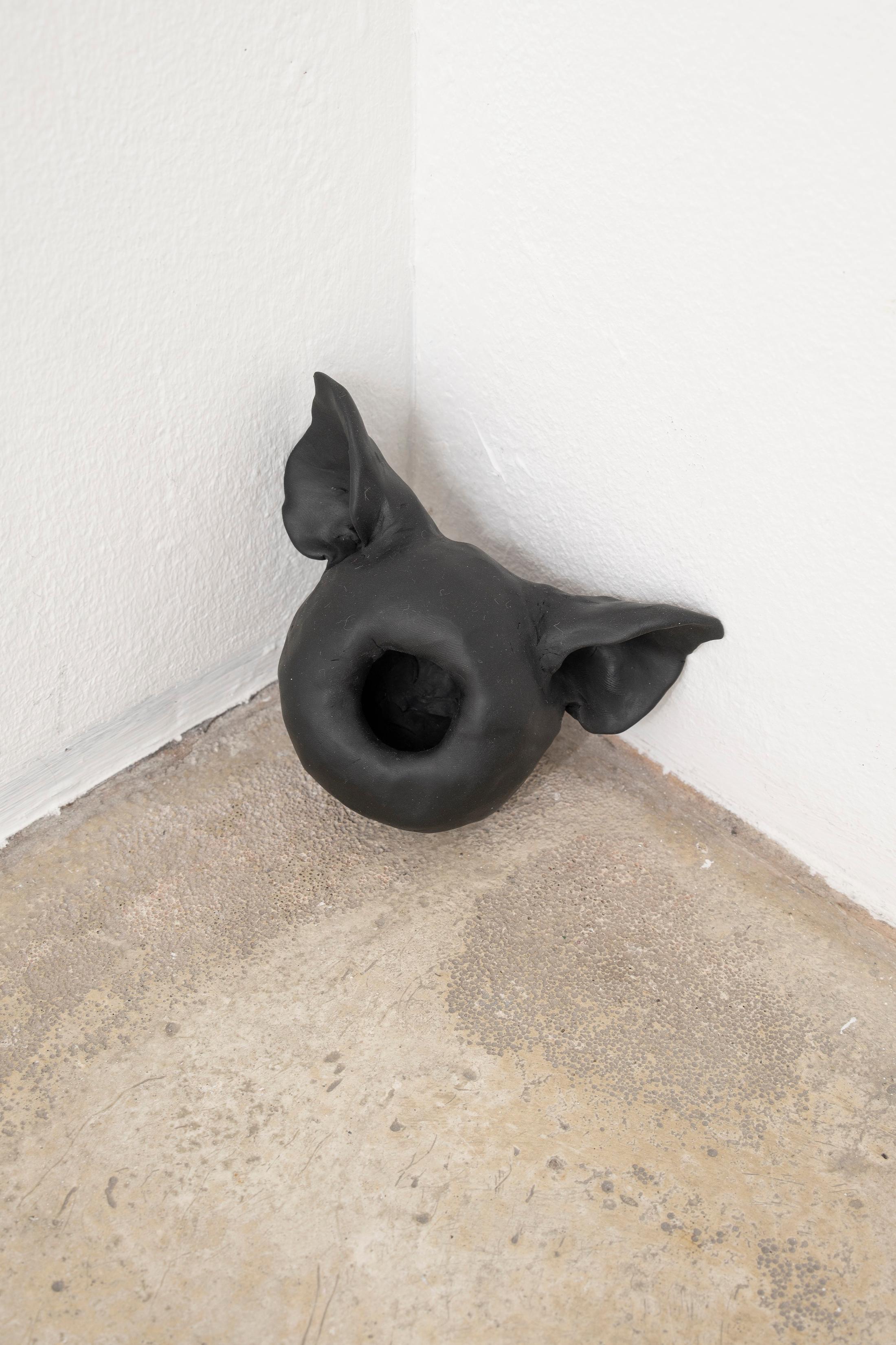 Exhibition View Group Show «THIS MESSAGE COULD BE FOR YOU; view on Elektra Stampoulou, black as coal, pig and hole, 2023, fimo, 10 x 12 x 11 cm» at Milieu, Berne, 2023 / Photo: Claude Barrault / Courtesy: the artist and Milieu