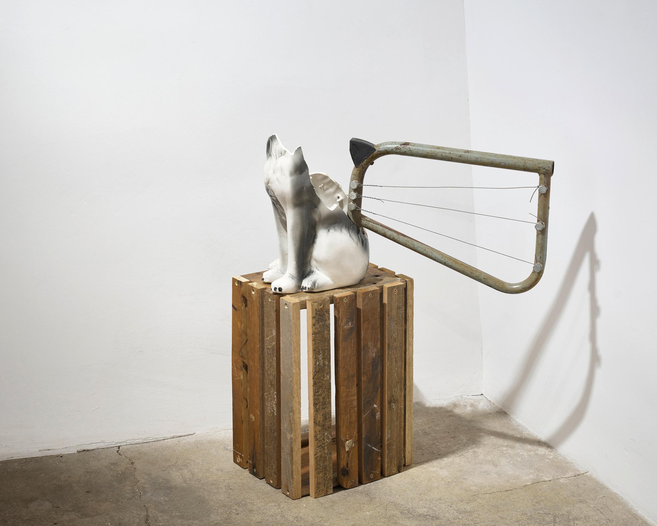 Exhibition View Kemang Wa Lehulere Solo Show «Where Did the Sky Go?; view on Kemang Wa Lehulere, Empire of Sleep, 2018 - 2020, porcelain dog flled with concrete, metal pipe from slvaged shool desk, wooden trophy shield, steel wires, 82 x 60 x 50 cm» at Galerie Tschudi, Zuoz, Engadin, 2020 / Photo: Ralph Feiner / Courtesy: the artist and Galerie Tschudi