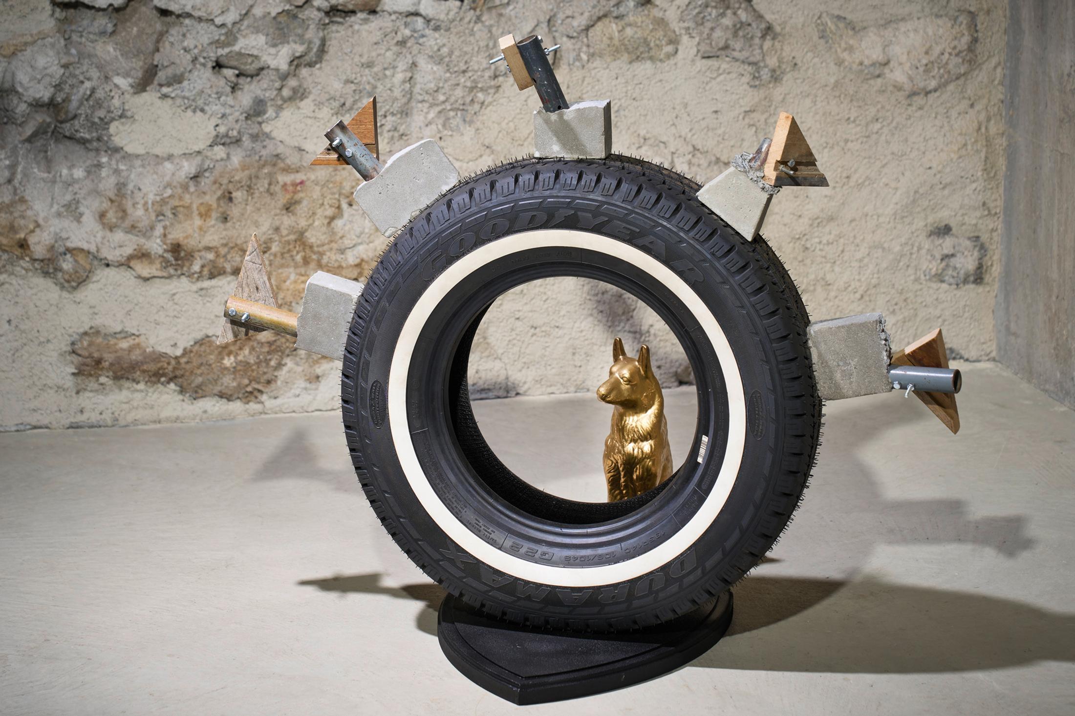 Exhibition View Kemang Wa Lehulere Solo Show «Where Did the Sky Go?; view on Kemang Wa Lehulere, The Coronation, 2020, concrete moulds, metal pipes, car tyre, porcelain dog, wooden board, 87 x 105 x 50 cm» at Galerie Tschudi, Zuoz, Engadin, 2020 / Photo: Ralph Feiner / Courtesy: the artist and Galerie Tschudi