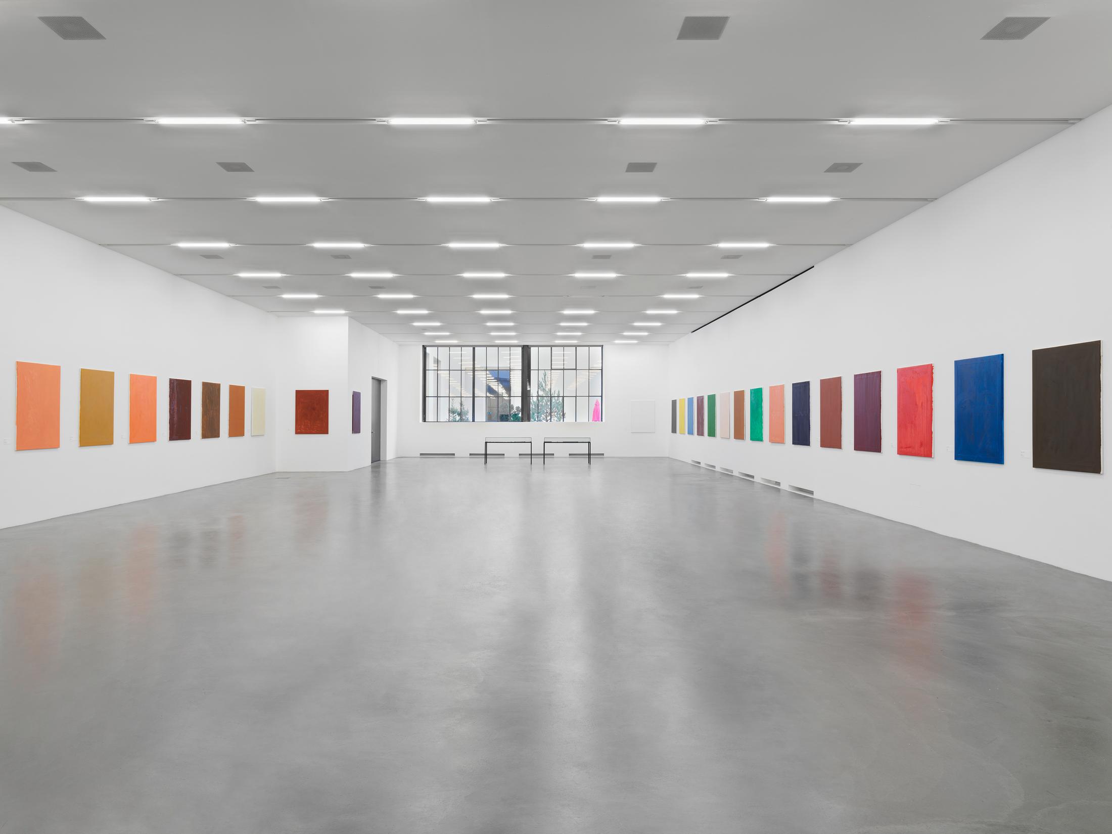 Maria Eichhorn, 72 Bilder (1992–93), 72 monochrome painted canvases, name tags, labeling on the reverse side of the canvases, each 123 x 93 cm, vitrine, Sammlung Migros Museum für Gegenwartskunst, photo: Stefan Altenburger Photography, Zurich © ProLitteris, Zürich