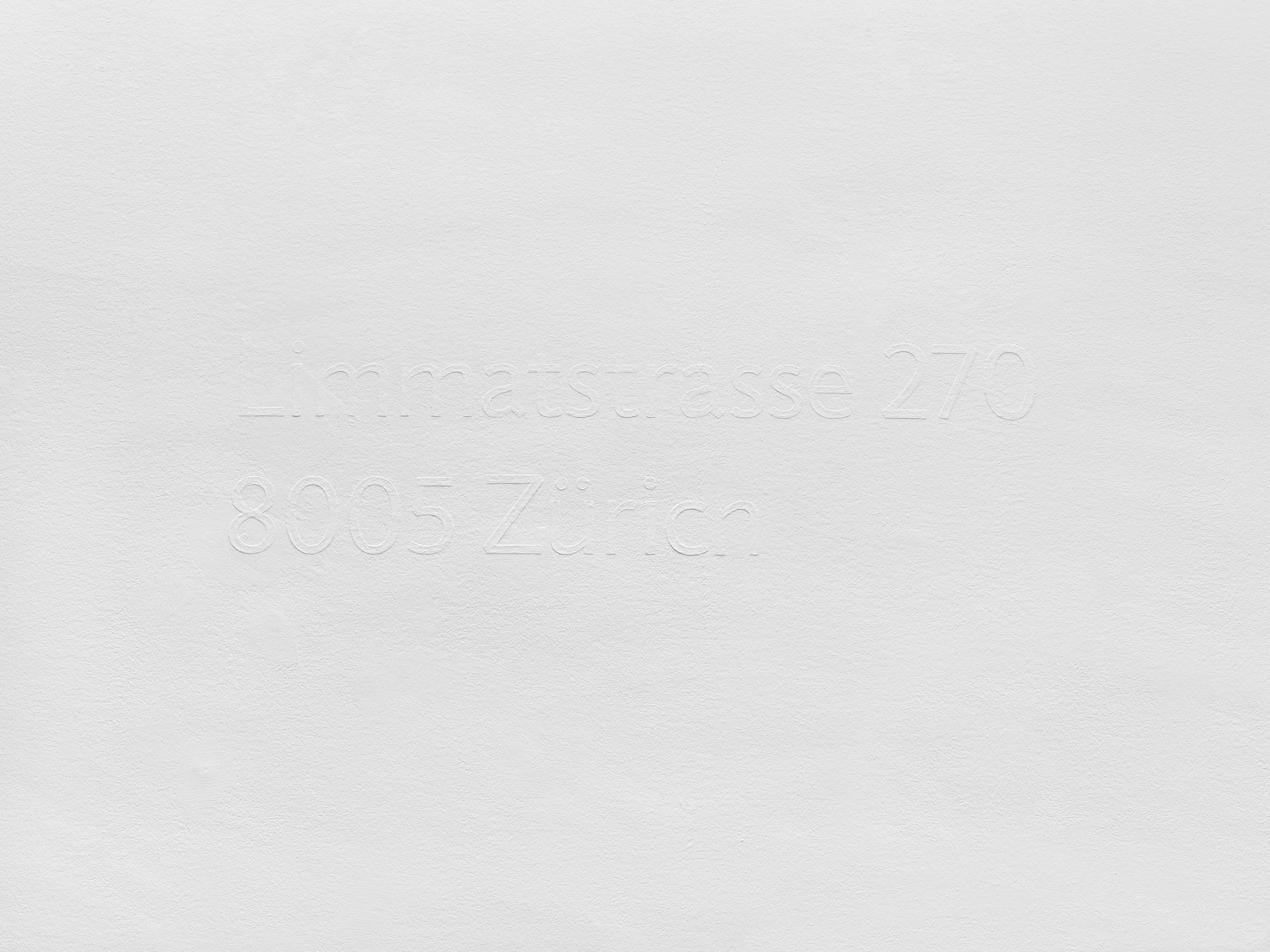 Maria Eichhorn, Limmatstrasse 270, 8005 Zürich (2011/2018), postal address, wall text, bas-relief, white emulsion paint on a white wall, manual application of paint with a brush in multiple layers, typeface: Jigsaw Regular, Dimensions variable, here: 27 x 98,3 cm, Wall painting: Christian Eberhard, Sammlung Migros Museum für Gegenwartskunst, photo: Stefan Altenburger Photography, Zurich © ProLitteris, Zürich