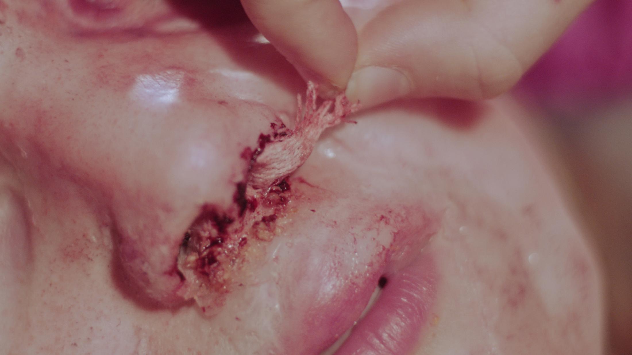 Exbition View Marianna Simnett Soloshow «LAB RATS; view on Blood In My Milk, 2018 (video still)» at Kunsthalle Zürich, Zurich, 2019 / © Marianna Simnett / Courtesy: the artist and Kunsthalle Zürich