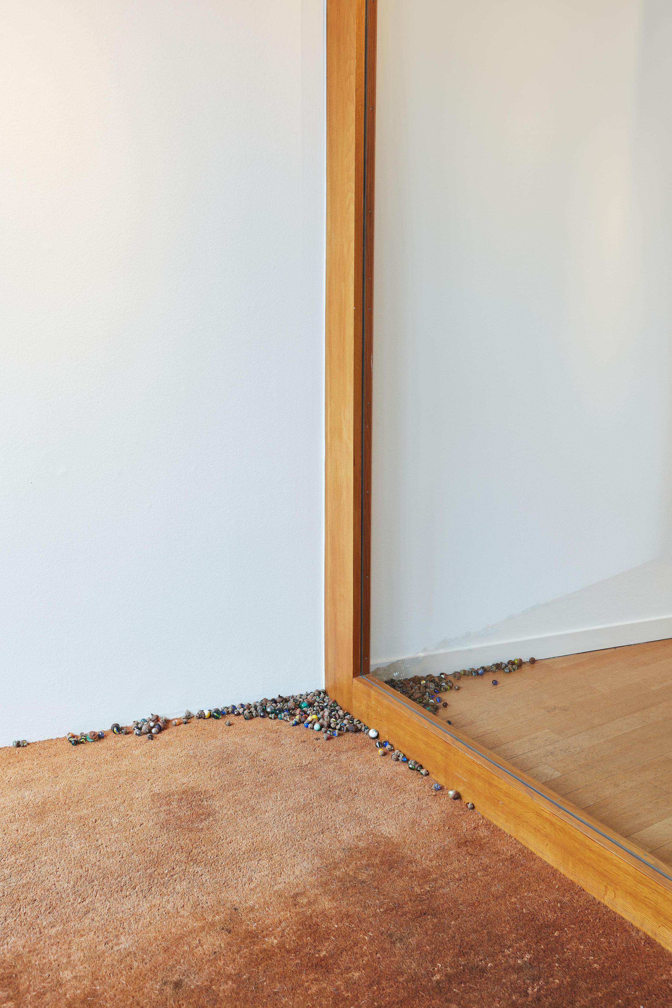 Exhibition View Groupshow «Motor; view on Aline Zeltner, untitled, marbles in acorn hats, variable dimensions, 2020» at Kunstraum Riehen, Riehen, Basel, 2020 / Photo: Moritz Schermbach / Courtesy: the artist