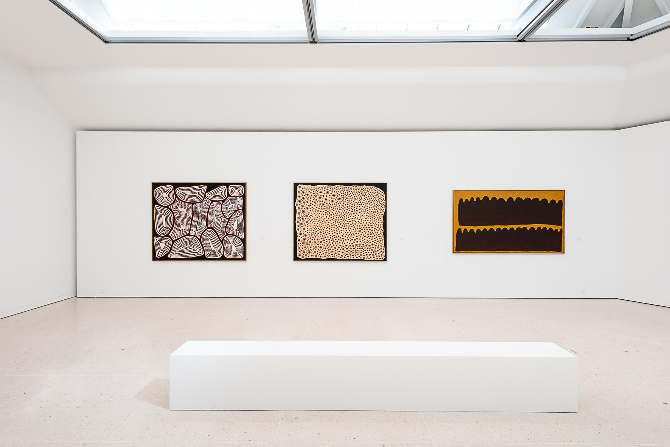 Exhibition View Groupshow «My Mothers Country; view on Billy Nolan Tjapangati, Tingari, 2002; Nyurapayia Nampitjinpa (Mrs. Bennett), Kapi Tjukurrpa, Water-Dreaming, 2007; Long Tom Tjapanangka, Puli Kutjarra, Two Hills, 2000» at Kunsthaus Zug, Zug, 2019 / Photo: Jorit Aust / Courtesy: the artists, Collection Clement and Kunsthaus Zug